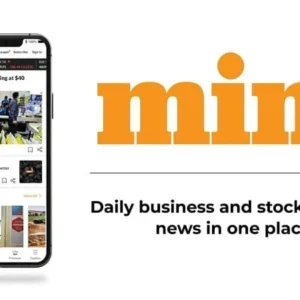 A person looking at their phone with the Mint app open.